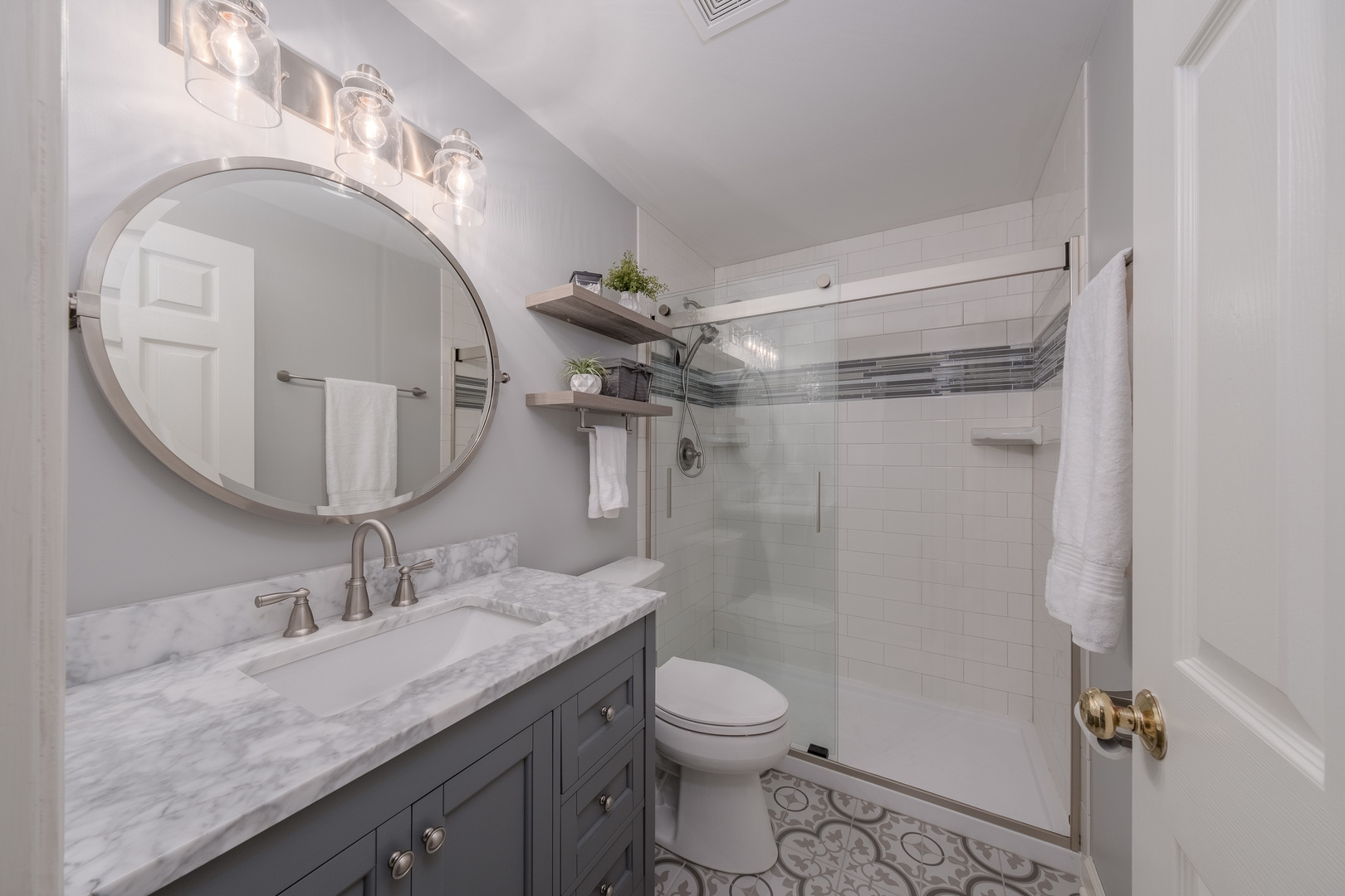 2410 Highland Road Geneva, IL 60134 - Photo 16 of 26 a bathroom with a granite countertop sink a mirror and toilet