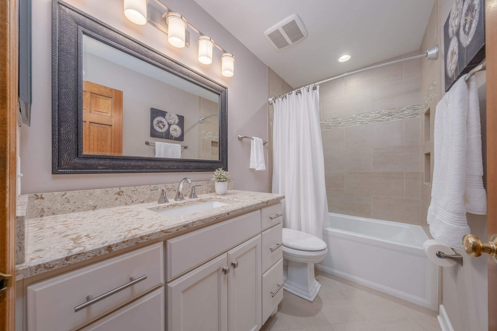 2410 Highland Road Geneva, IL 60134 - Photo 20 of 26 a bathroom with a granite countertop sink toilet and shower