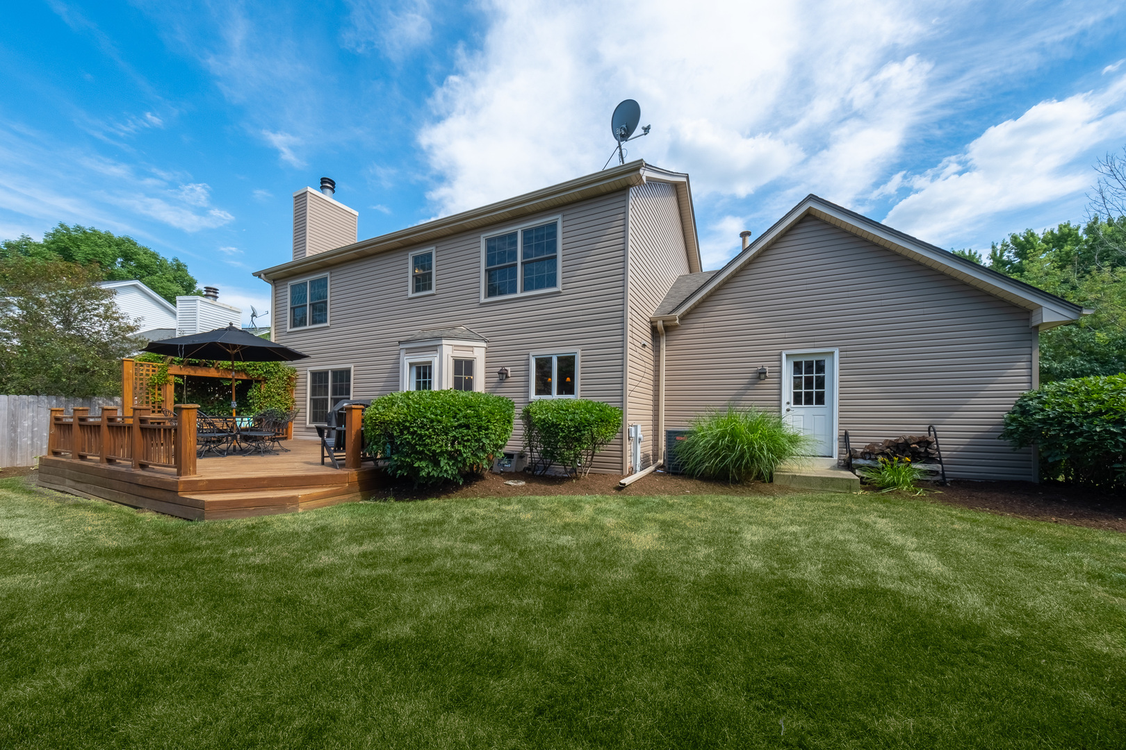 2410 Highland Road Geneva, IL 60134 - Photo 25 of 26 a view of a house with a back yard