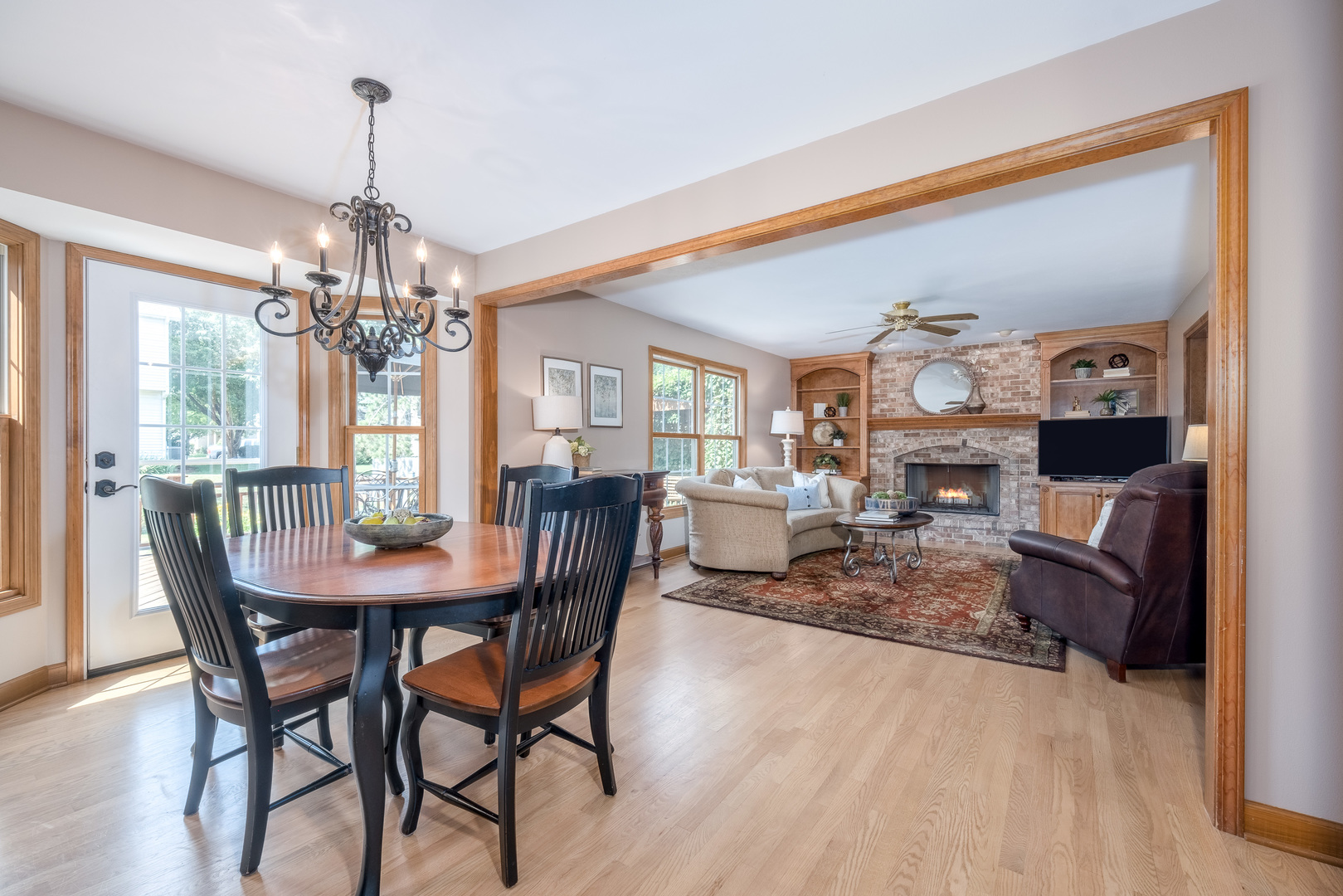 2410 Highland Road Geneva, IL 60134 - Photo 7 of 26 a view of a dining room with furniture and a chandelier