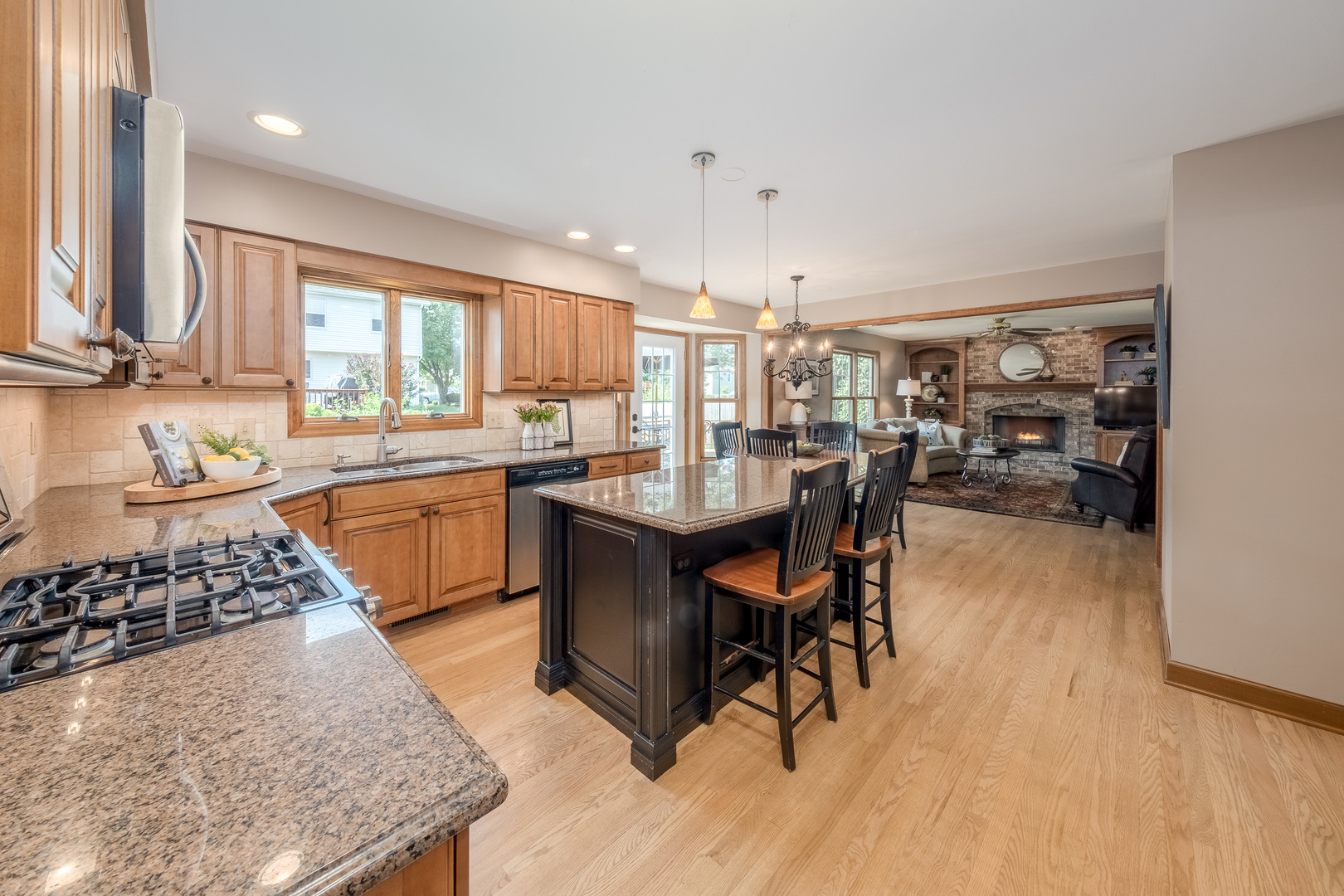 2410 Highland Road Geneva, IL 60134 - Photo 8 of 26 a kitchen with a table chairs stove and cabinets