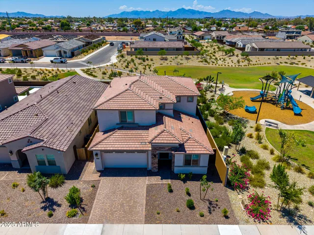 an aerial view of a house with a ocean view