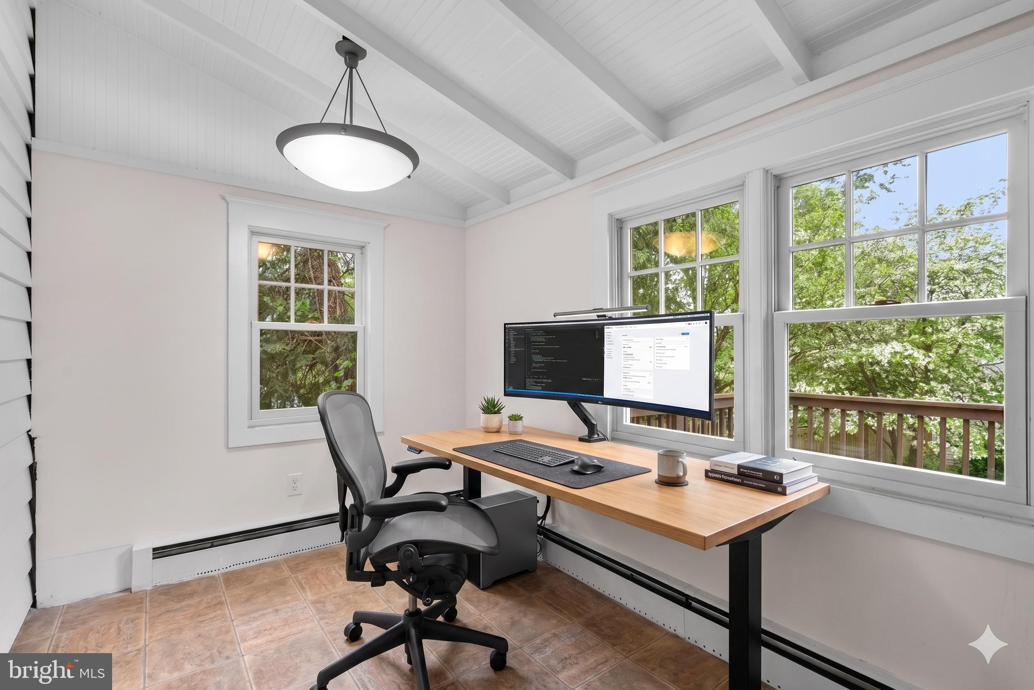 9120 Glenridge Road Silver Spring, MD 20910 - Photo 17 of 59 a view of a workspace with furniture and a window