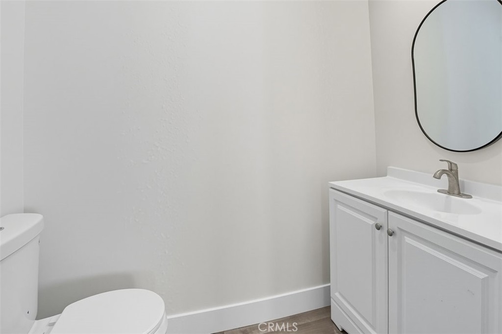 19258 Strathern Street Reseda, CA 91335 - Photo 12 of 36 a bathroom with a sink toilet and a mirror