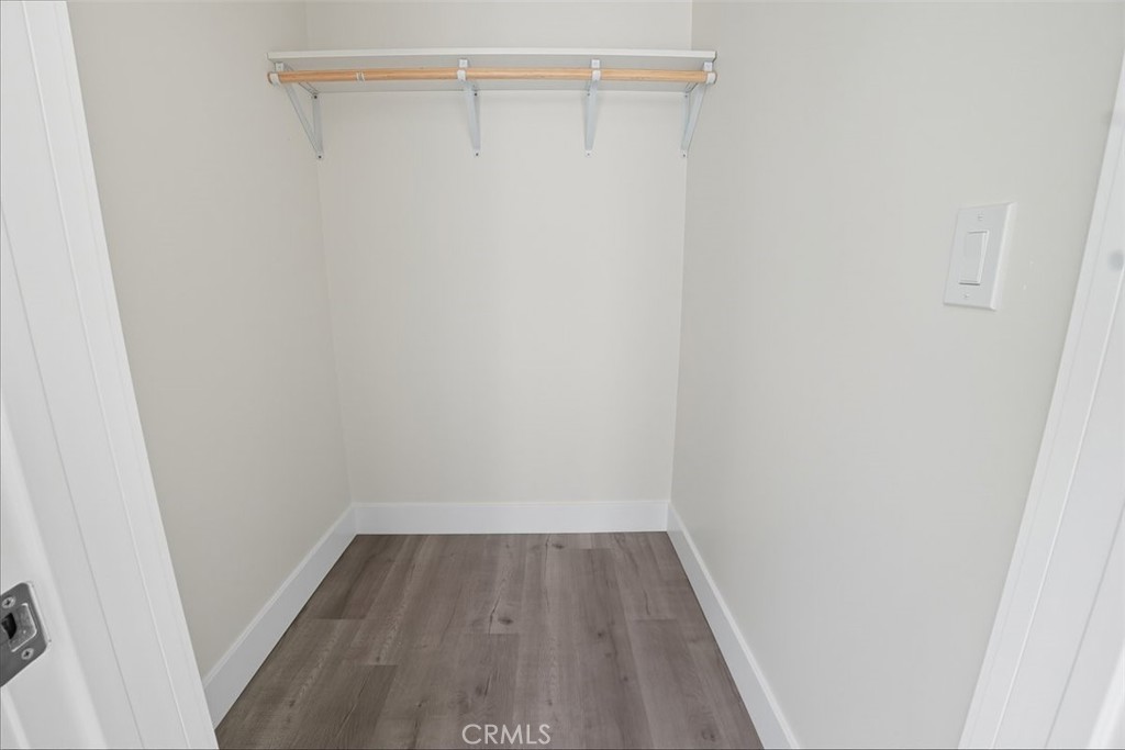 19258 Strathern Street Reseda, CA 91335 - Photo 16 of 36 a view of a room with wooden floor