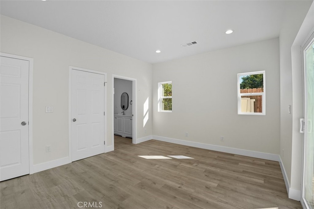 19258 Strathern Street Reseda, CA 91335 - Photo 17 of 36 a view of a livingroom with wooden floor and window