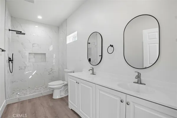 a kitchen with stainless steel appliances a refrigerator and a sink