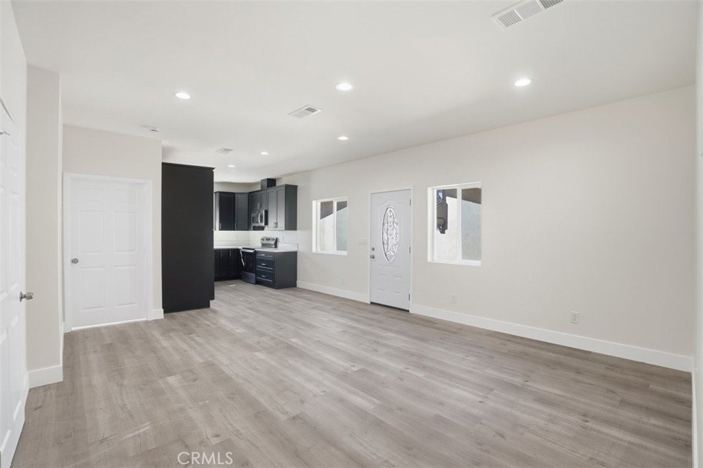 19258 Strathern Street Reseda, CA 91335 - Photo 21 of 36 a view of a kitchen with a refrigerator and a stove top oven