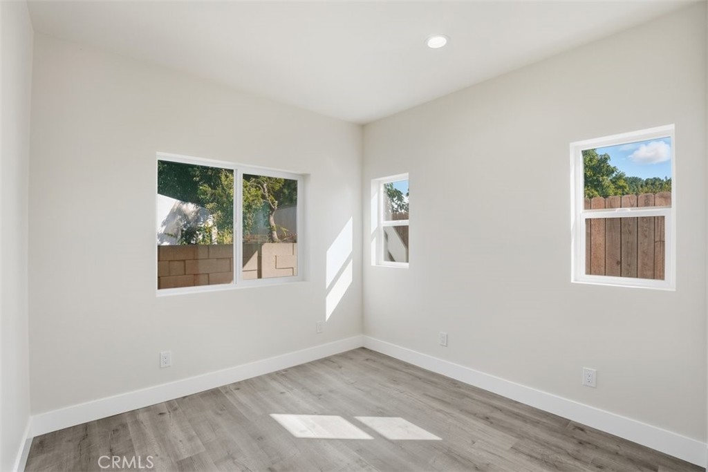 19258 Strathern Street Reseda, CA 91335 - Photo 22 of 36 an empty room with windows
