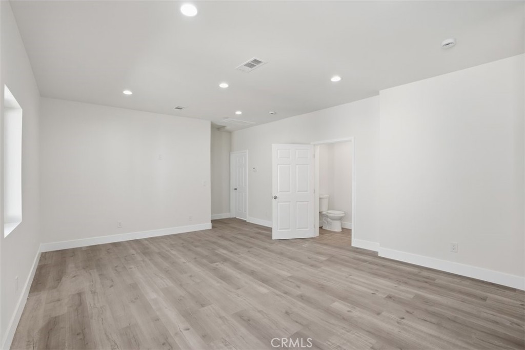 19258 Strathern Street Reseda, CA 91335 - Photo 23 of 36 a view of an empty room with wooden floor