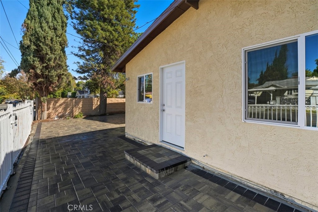 19258 Strathern Street Reseda, CA 91335 - Photo 26 of 36 a view of a backyard with large trees and plants