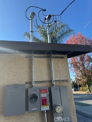 a sign board on a wall next to a wall