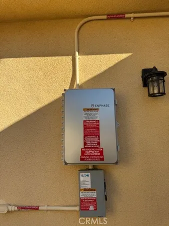 a sign board on a wall next to a wall