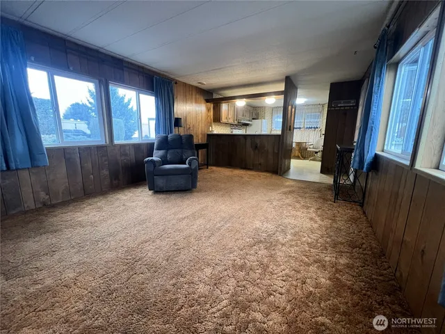 a view of livingroom with furniture and windows