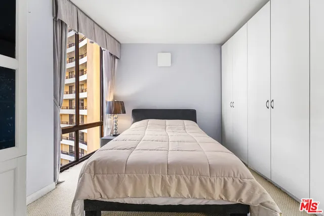 a view of a tennis court with a fence