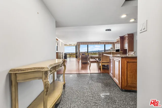 a view of a kitchen with furniture and a kitchen