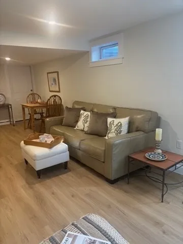 a living room with furniture and a table