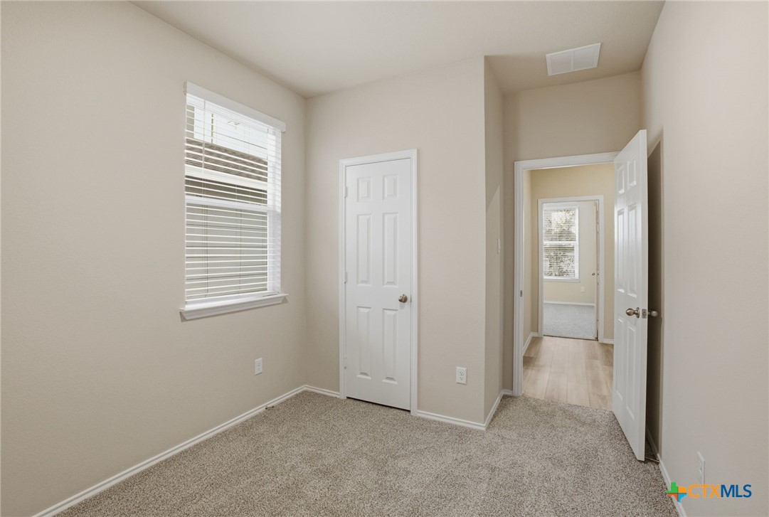 1126 Stone Vly Road, Unit B Temple, TX 76502 - Photo 16 of 26 a view of an empty room with closet and a window
