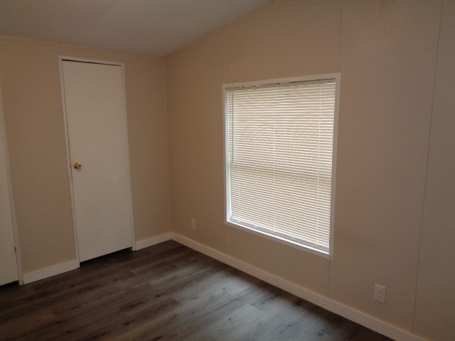 15120 Capitol Hill Road Montgomery, TX 77316 - Photo 13 of 17 an empty room with wooden floor and windows