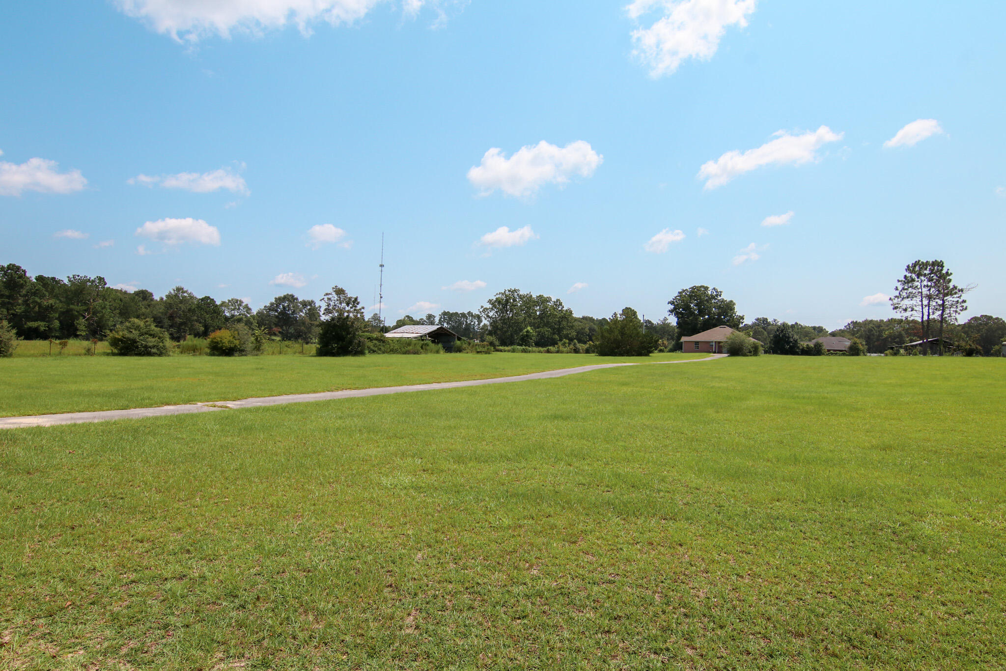924 Hwy C4a Baker Baker, FL 32531 - Photo 15 of 47 a view of a green field with clear sky