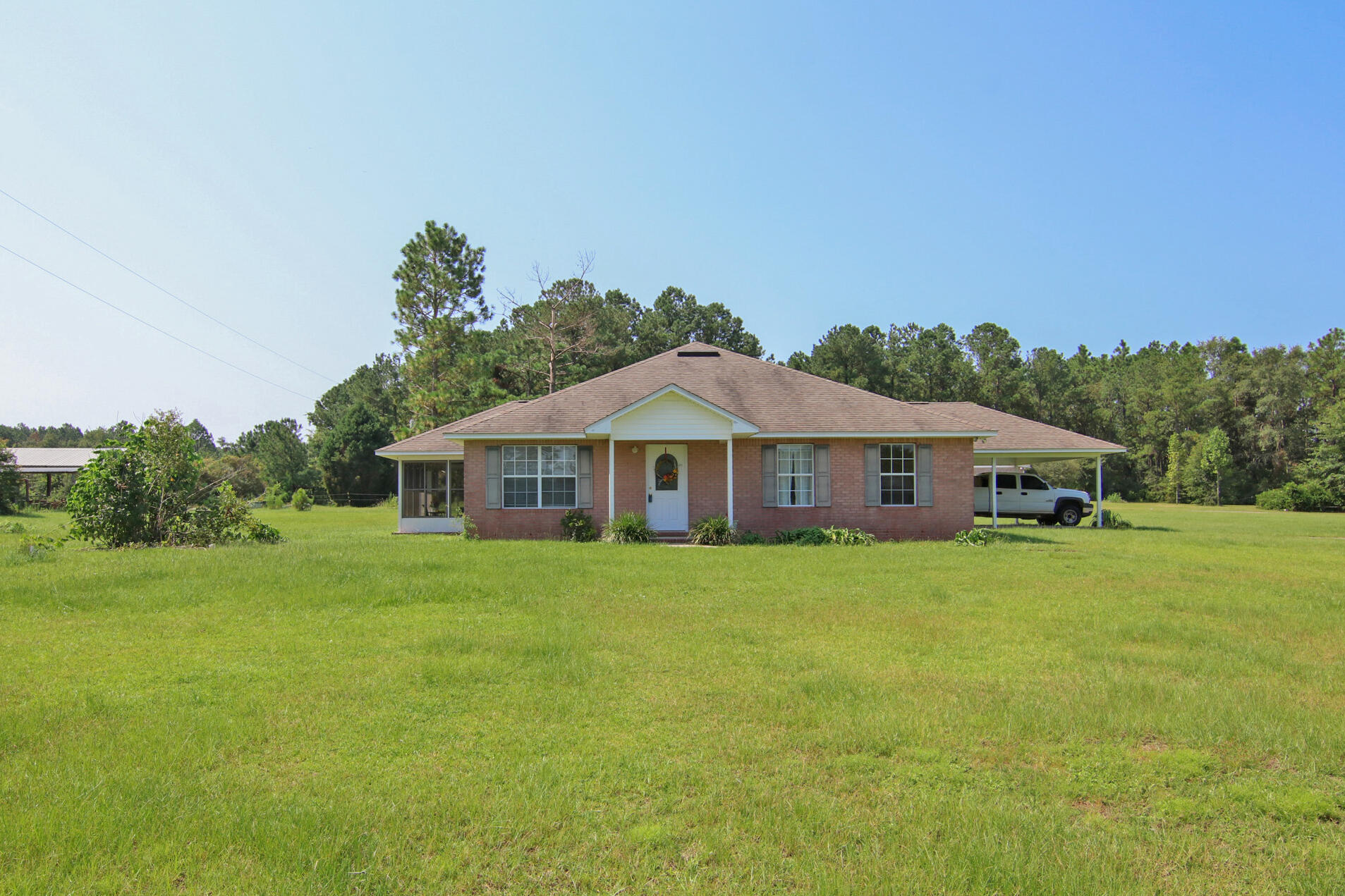924 Hwy C4a Baker Baker, FL 32531 - Photo 21 of 47 a front view of a house with a garden