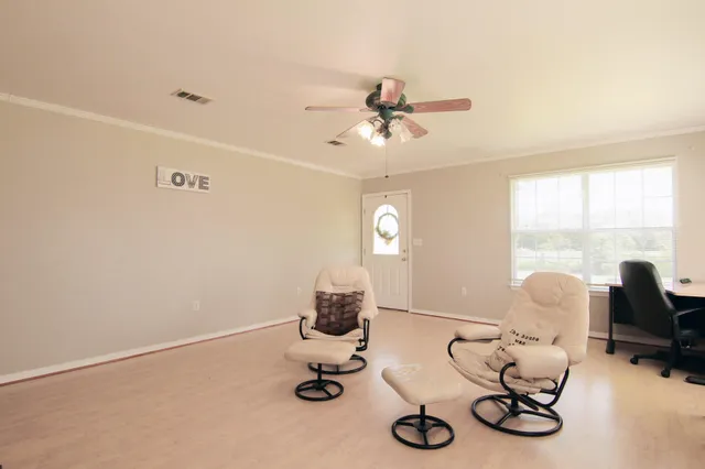 a room with furniture and a window