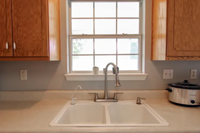 a bathroom with a sink and a window