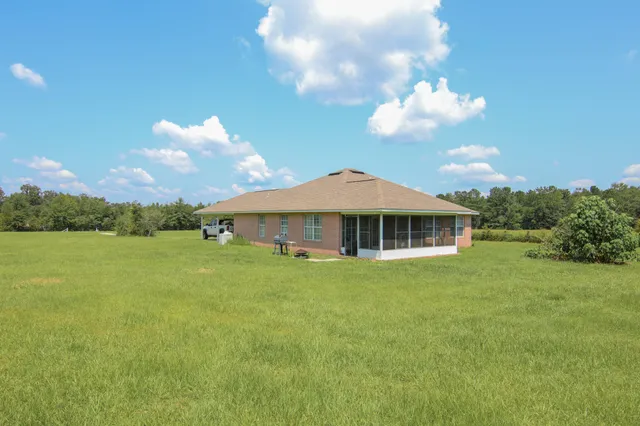 a view of a house with a big yard