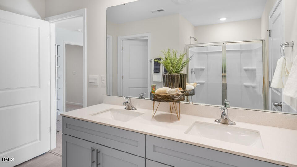 1244 Pavo Path Wendell, NC 27591 - Photo 15 of 33 a bathroom with a sink and a mirror