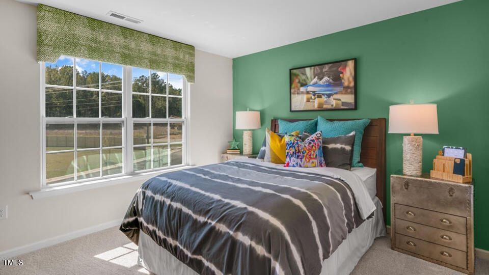 1244 Pavo Path Wendell, NC 27591 - Photo 16 of 33 a bedroom with a bed and a window