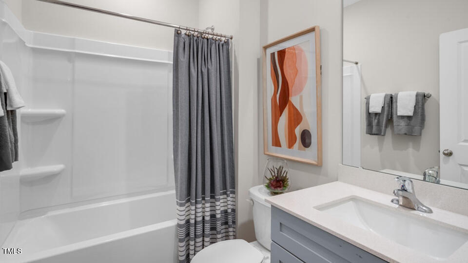 1244 Pavo Path Wendell, NC 27591 - Photo 18 of 33 a bathroom with a sink toilet and shower