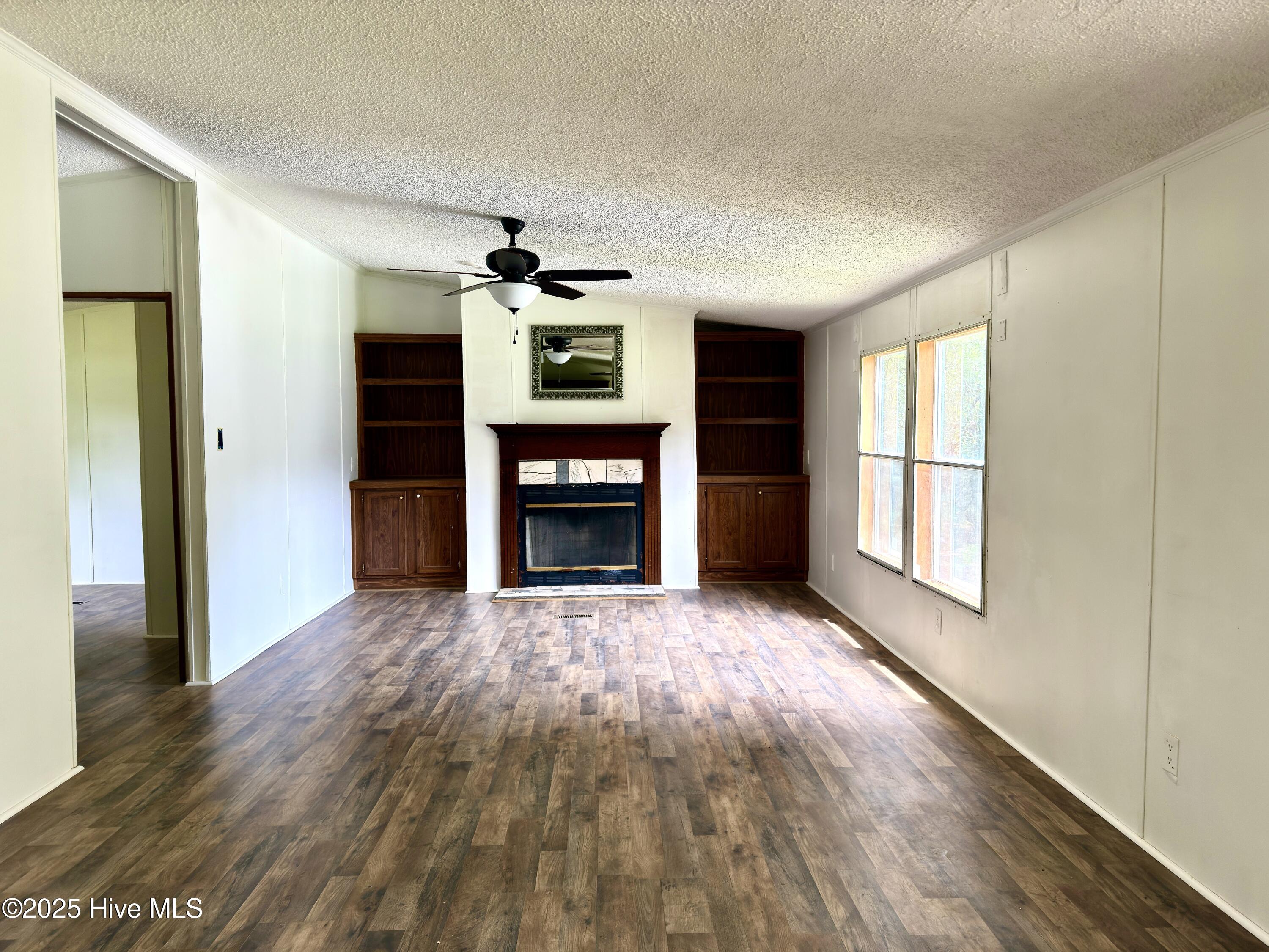 184 Hardison Road Holly Ridge, NC 28445 - Photo 2 of 22 Living room with wood burning fireplace