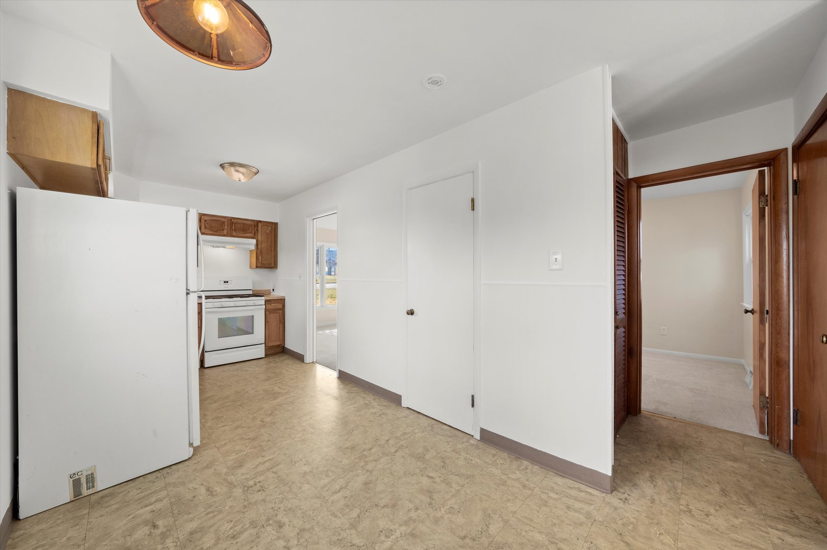 5628 West Monee Manhattan Road Monee, IL 60449 - Photo 11 of 37 a view of a kitchen with a sink and dishwasher a refrigerator a fireplace