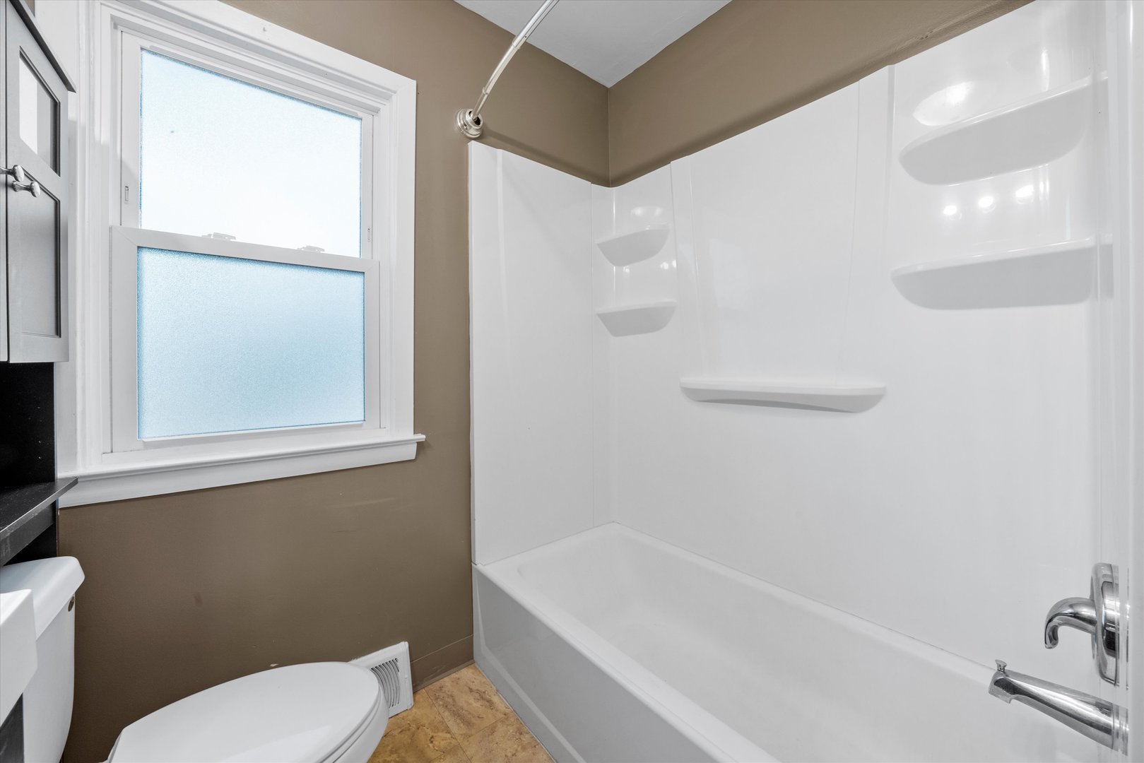 5628 West Monee Manhattan Road Monee, IL 60449 - Photo 26 of 37 a bathroom with a toilet and a bathtub