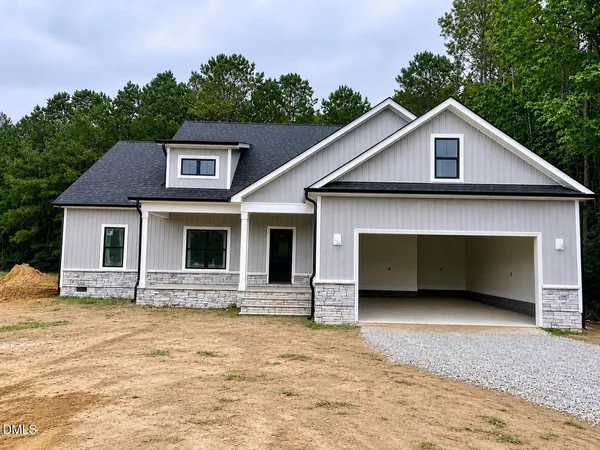 a front view of a house with yard