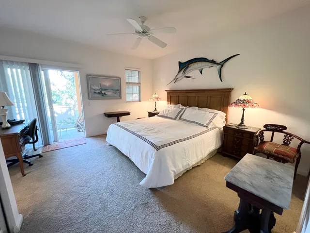 a bedroom with bed and window