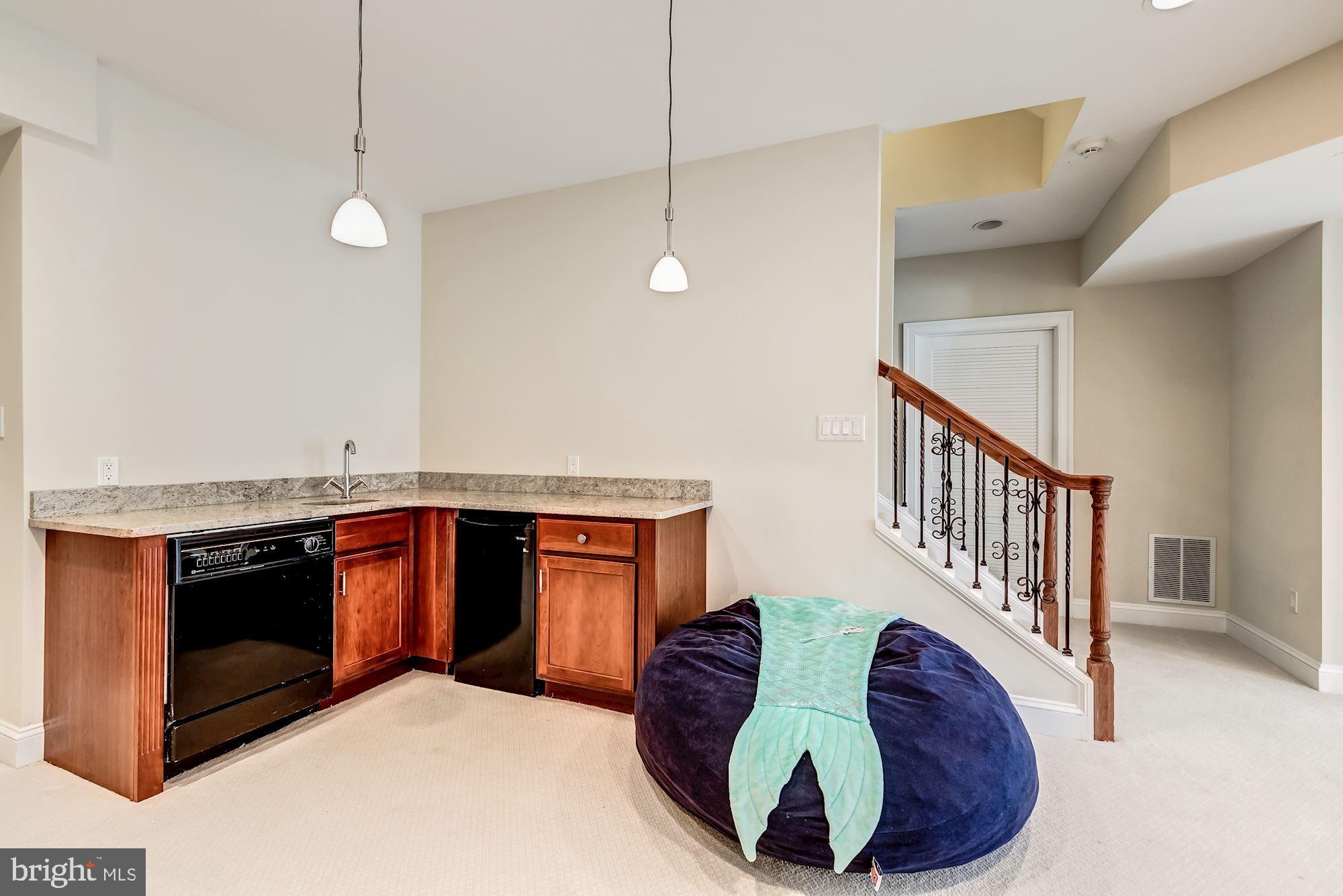 6658 Tennyson Drive McLean, VA 22101 - Photo 37 of 48 Lower Level wet bar/DW/Fridge