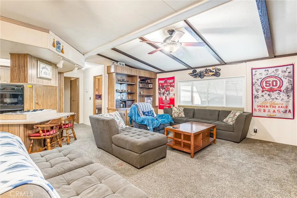 4000 Pierce Street, Unit 106 Riverside, CA 92505 - Photo 2 of 18 a living room with furniture and a chandelier