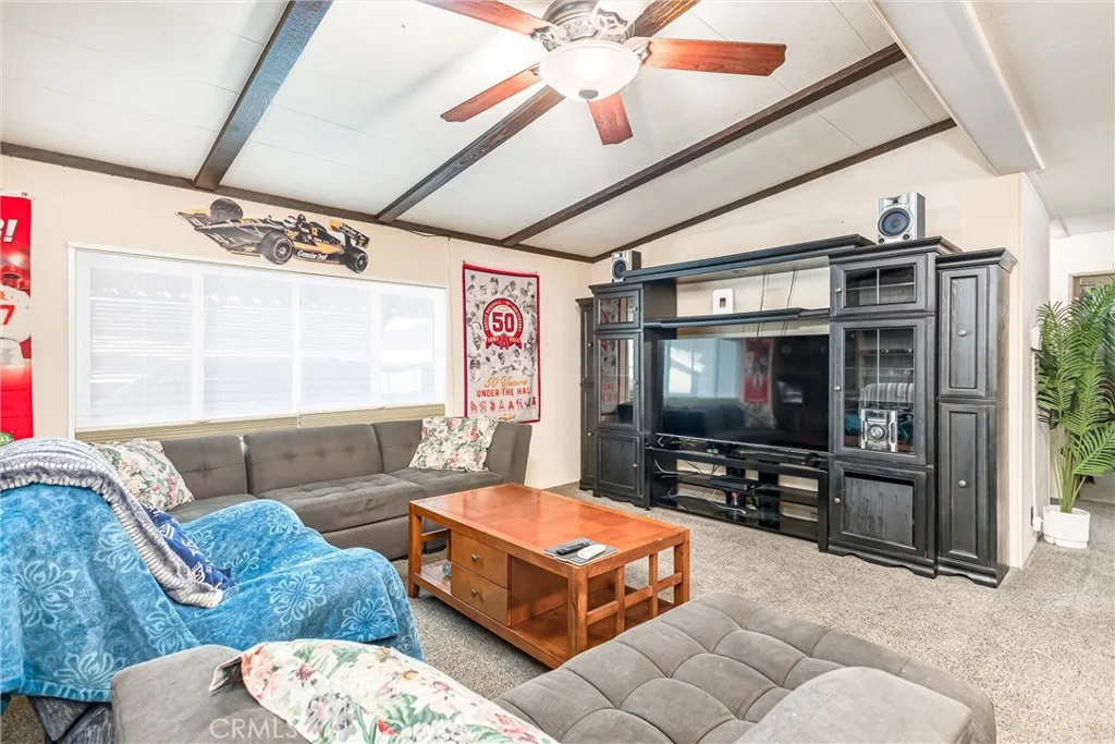 4000 Pierce Street, Unit 106 Riverside, CA 92505 - Photo 3 of 18 a living room with furniture and a flat screen tv