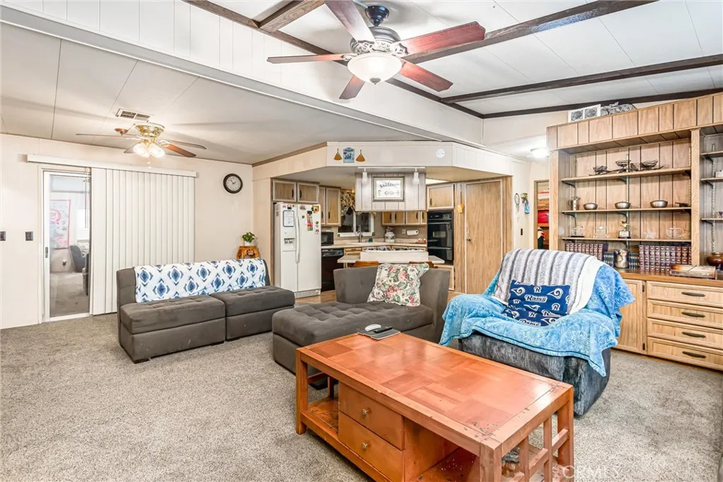 4000 Pierce Street, Unit 106 Riverside, CA 92505 - Photo 4 of 18 a living room with furniture and a book shelf
