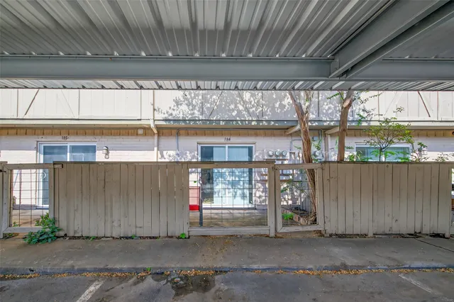 a front view of a building with glass windows and door