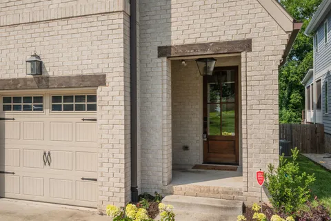 a front view of a house with a garage