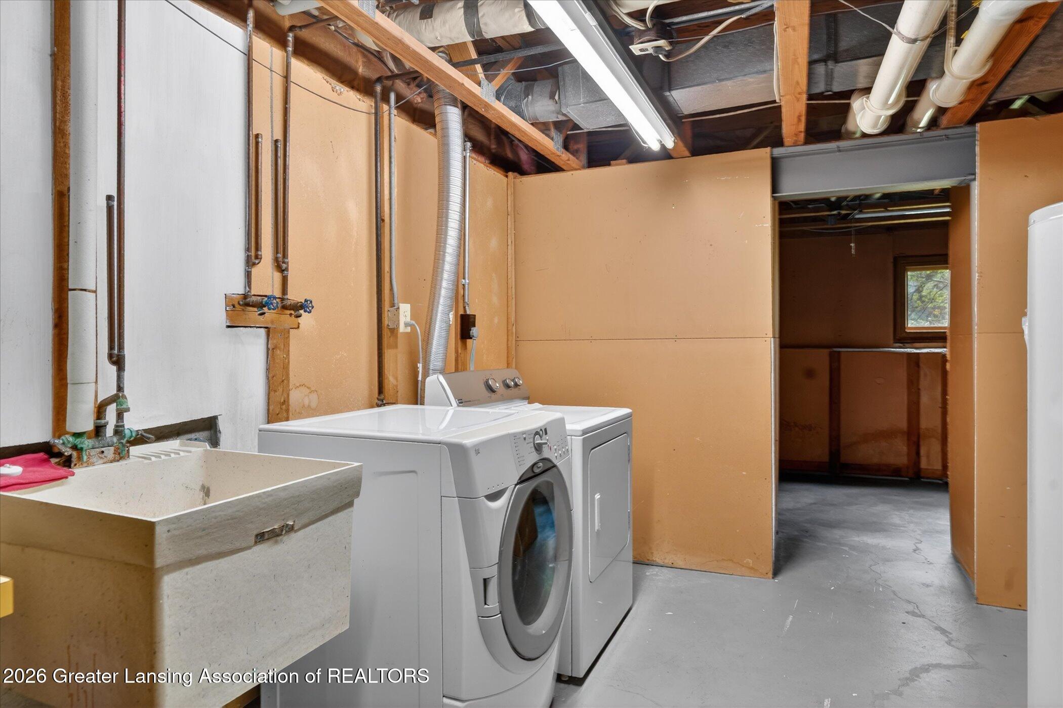 12830 Upton Road Bath, MI 48808 - Photo 30 of 38 Basement Laundry