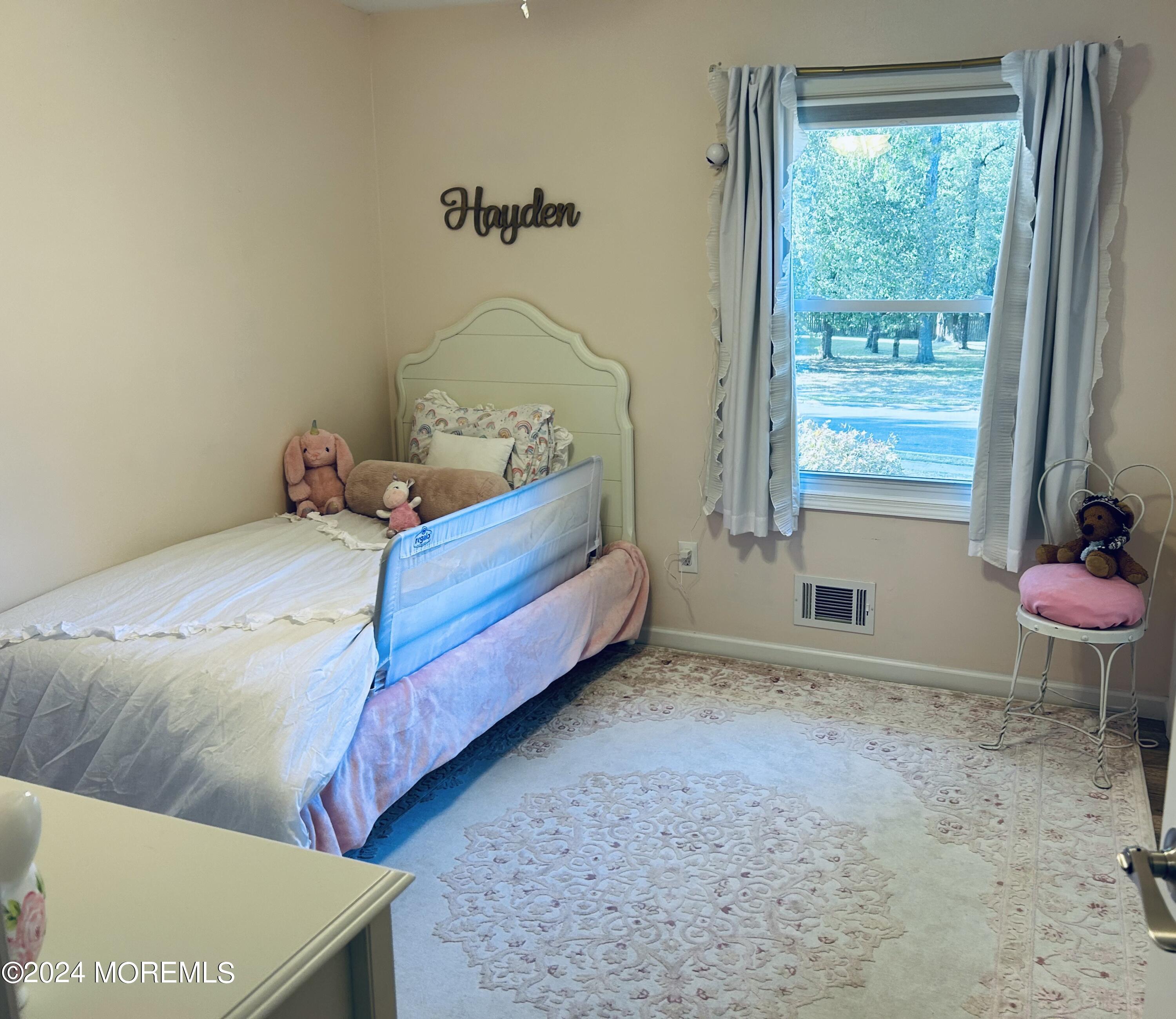 8 Old Farm Road Tinton Falls, NJ 07724 - Photo 15 of 24 a bedroom with a bed and windows