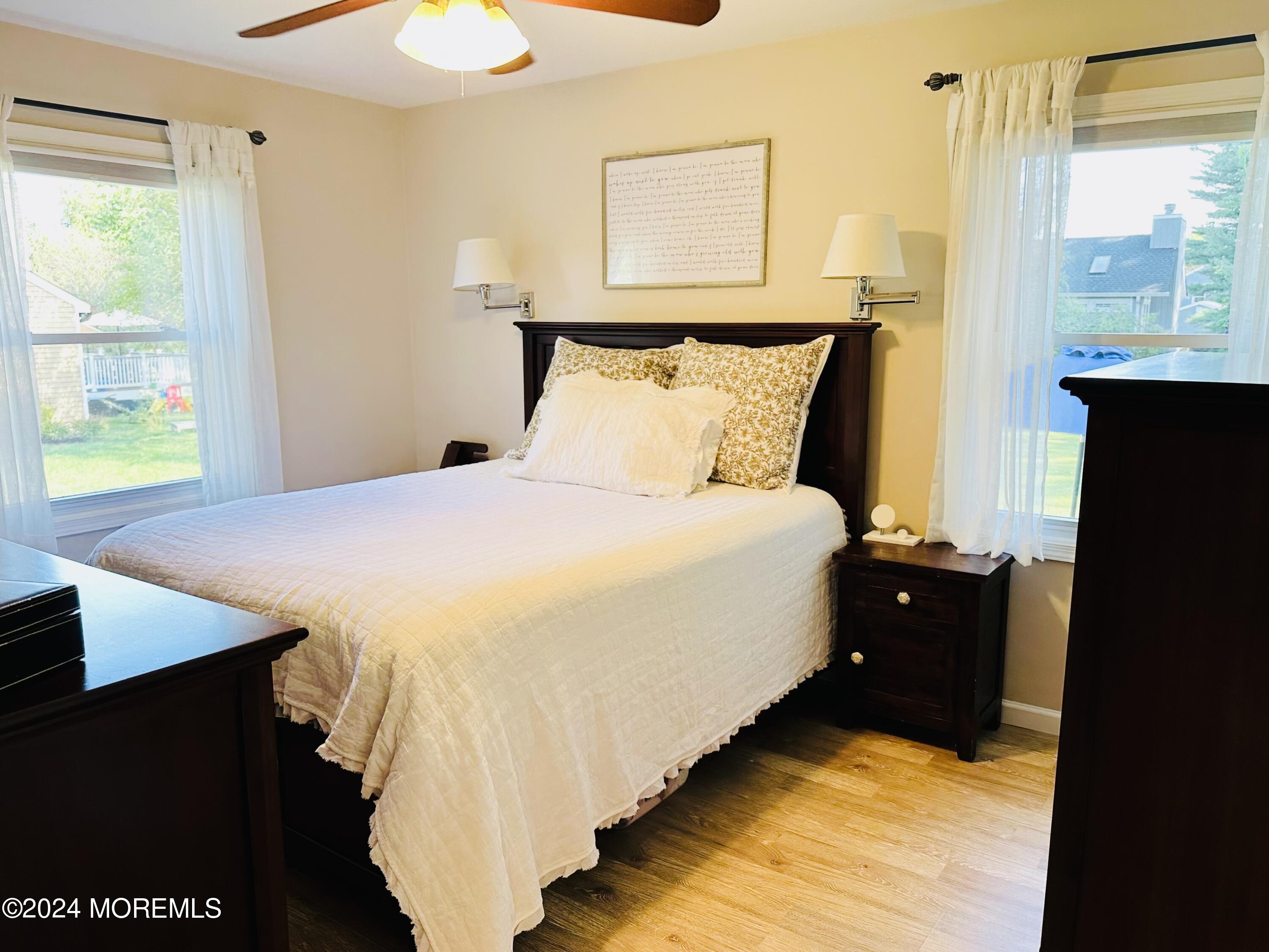 8 Old Farm Road Tinton Falls, NJ 07724 - Photo 16 of 24 a bed sitting in a bedroom next to a window