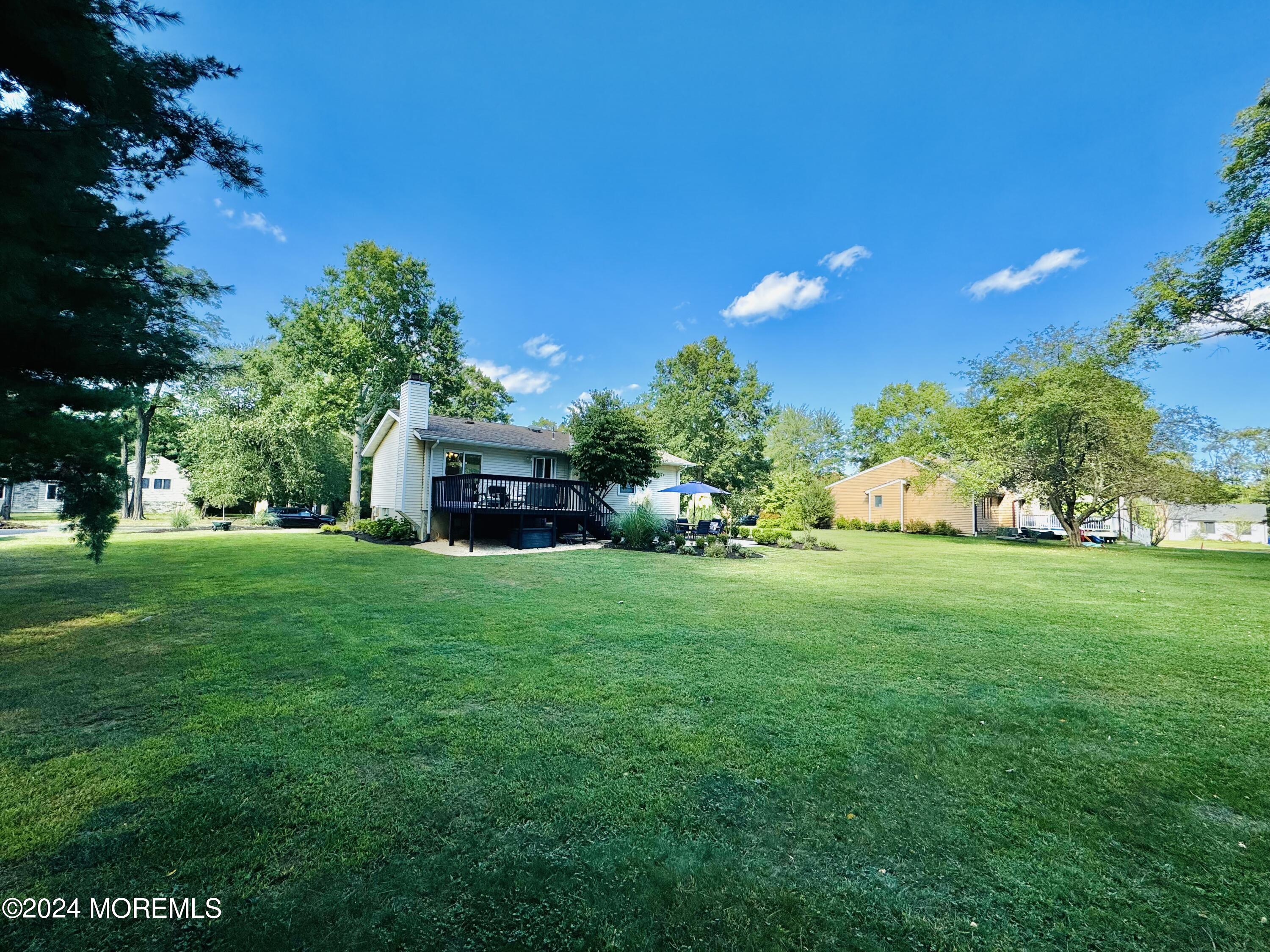 8 Old Farm Road Tinton Falls, NJ 07724 - Photo 22 of 24 a front view of a house with garden