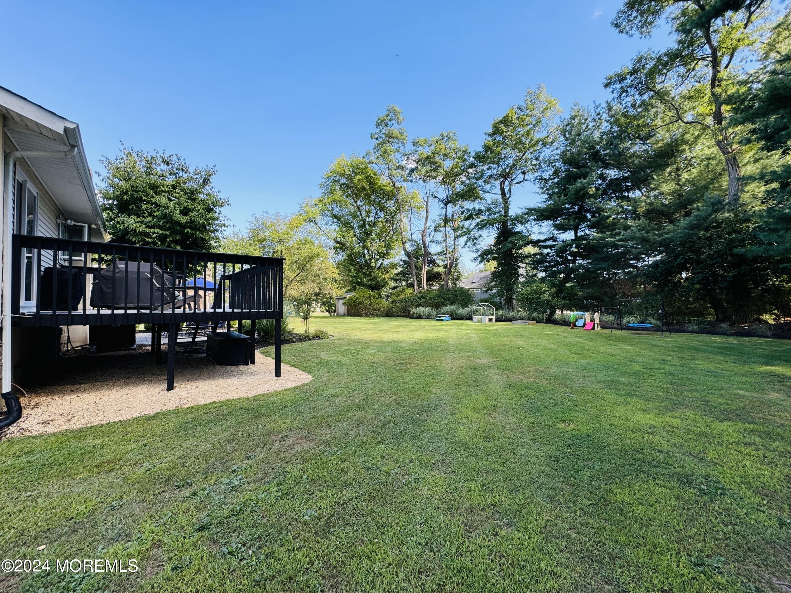 8 Old Farm Road Tinton Falls, NJ 07724 - Photo 23 of 24 a house view with a sitting space and garden