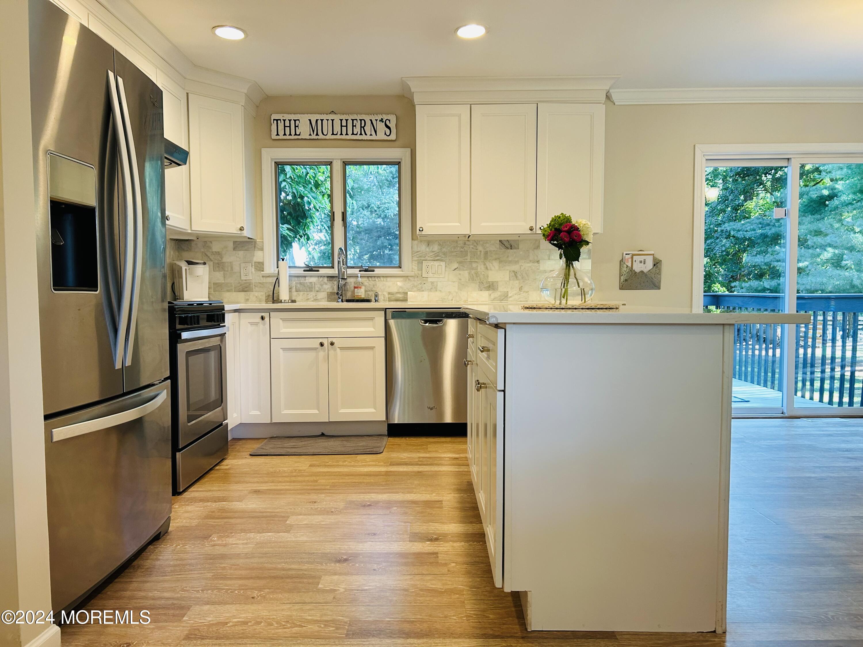 8 Old Farm Road Tinton Falls, NJ 07724 - Photo 4 of 24 a kitchen with stainless steel appliances granite countertop a stove a sink and a refrigerator
