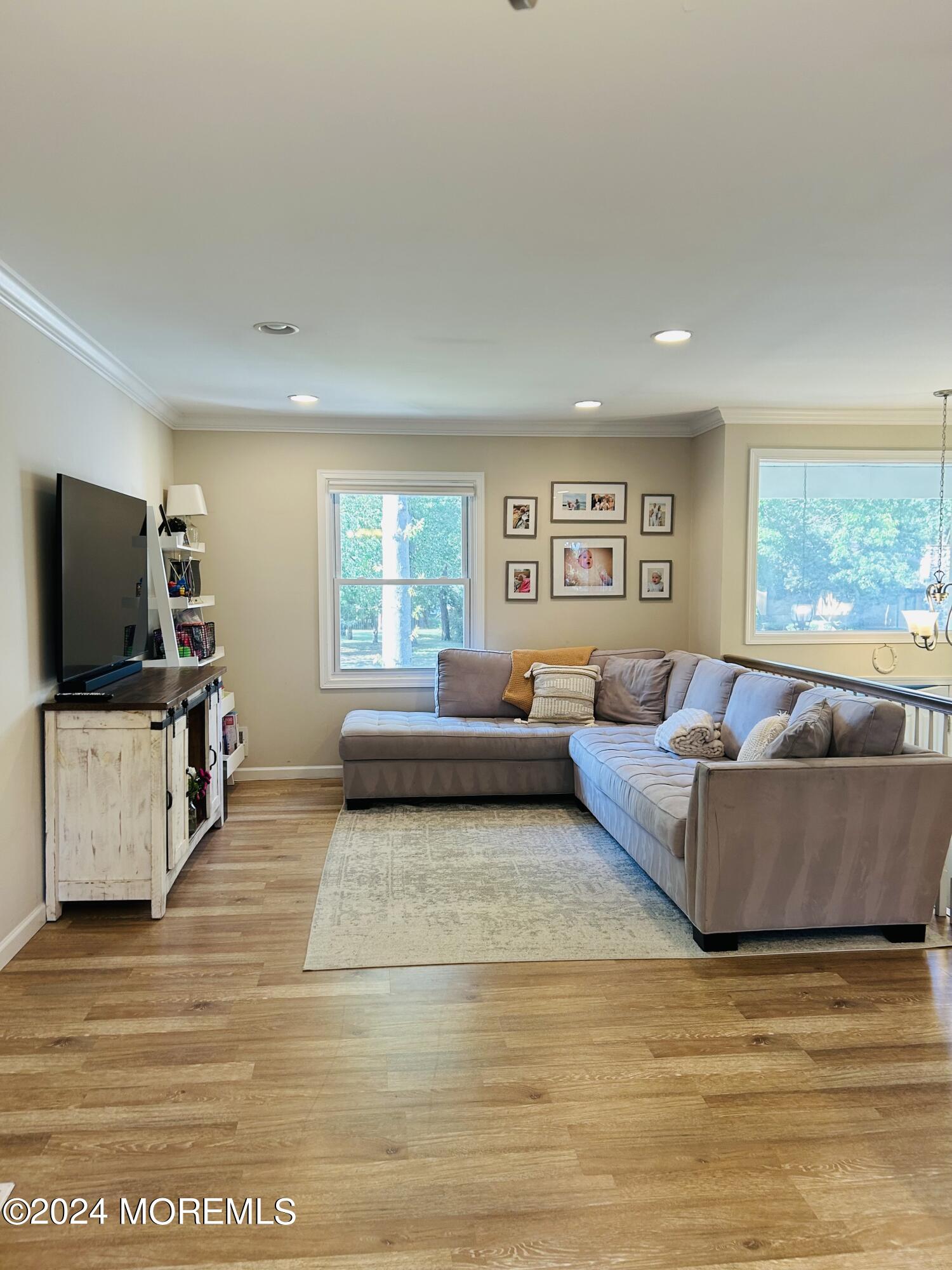 8 Old Farm Road Tinton Falls, NJ 07724 - Photo 8 of 24 a living room with furniture and a flat screen tv