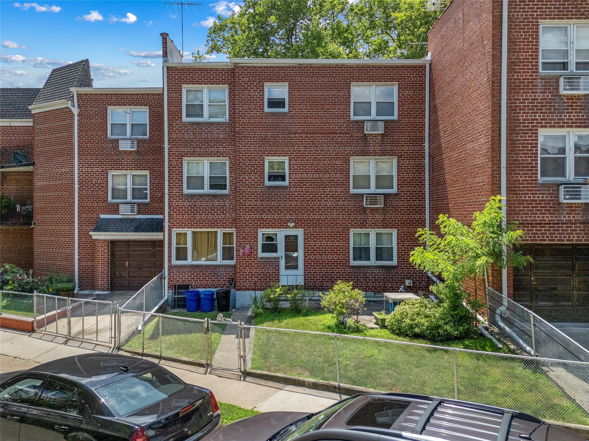 85-45 Abingdon Road Queens, NY 11415 - Photo 11 of 13 a view of a brick building next to a yard